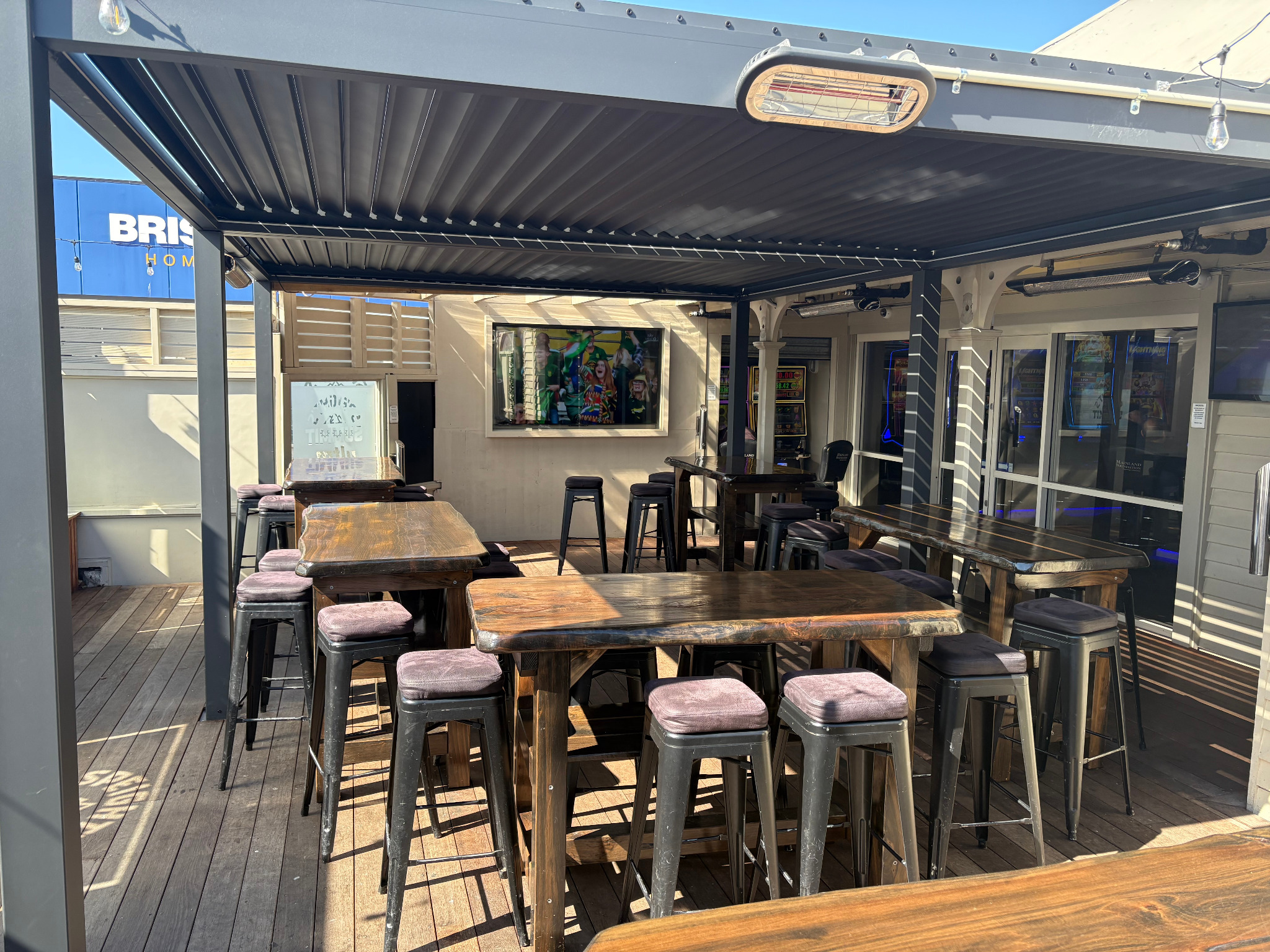 Bush Inn Tavern beer garden with timber tables under the covered roof